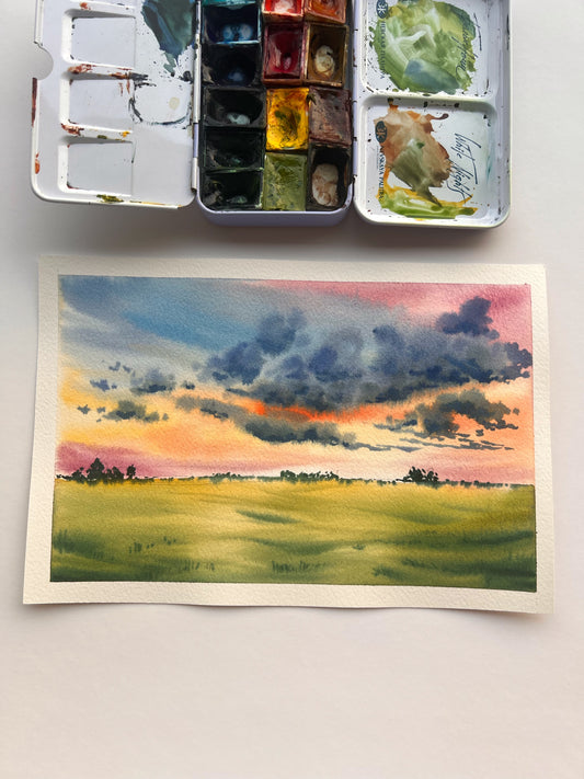 soft fluffy clouds and field watercolor painting